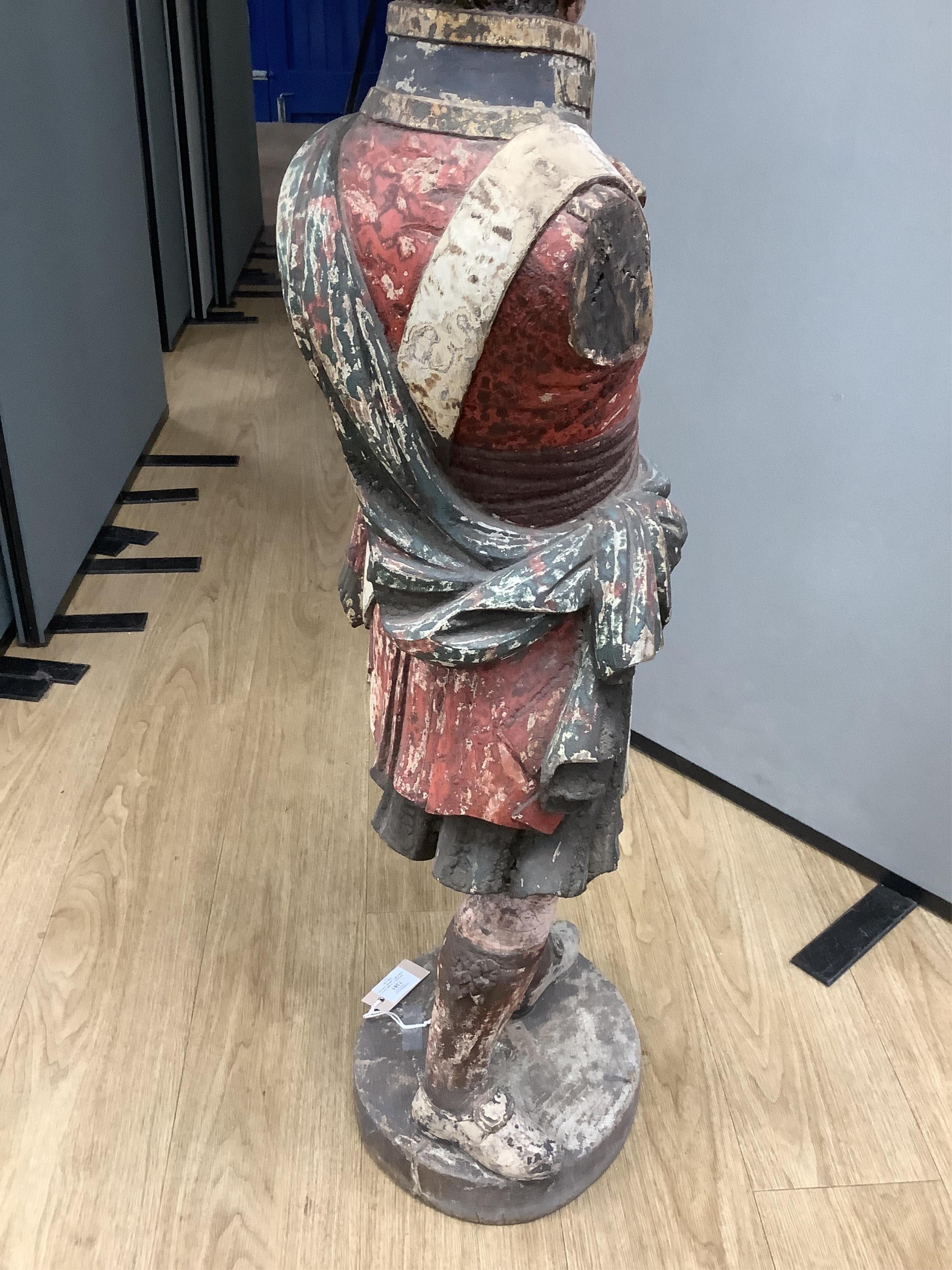 A large 19th century carved and painted Highlander ‘Snuff’ shop advertising figure. 109cm high. Condition - paint work and base weathered, arms detached.